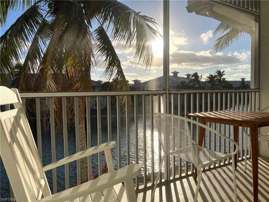 Balcony at dusk featuring a sunroom