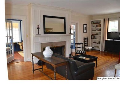 Large living room with impressive fireplace.