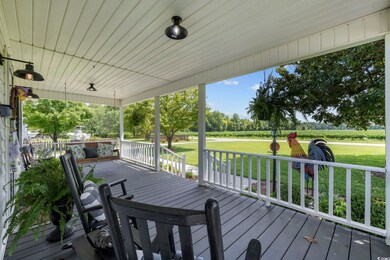 Wooden terrace featuring a lawn