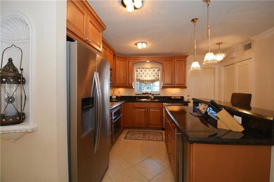 Kitchen has built-in wine cooler, double door refr