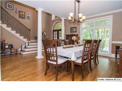 From the front door, enter the grand 2 story foyer