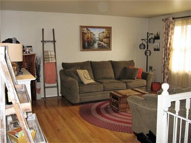 The living room has plenty of wall space for all o
