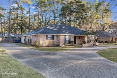 Single story home with a large front yard  with lo