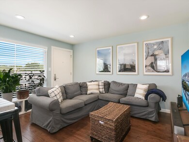 Living area with hardwood / wood-style floors and