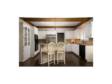Classic White kitchen with granite and island.
