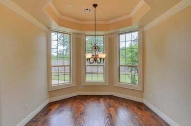 FORMAL DINING ROOM: Bay Windows encased in wood; N