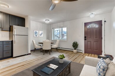Living / dining area - shown virtually staged. Uni