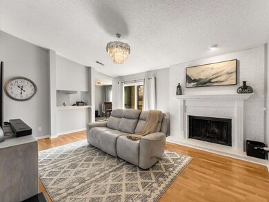 Living room with hardwood / wood-style flooring, l