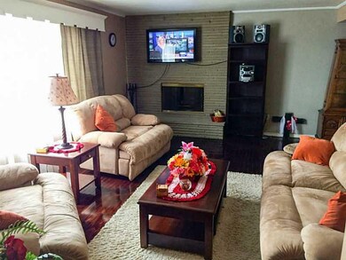 Living Room. Floor to ceiling Brick Log Burning fi