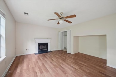 Unfurnished living room featuring light wood finis