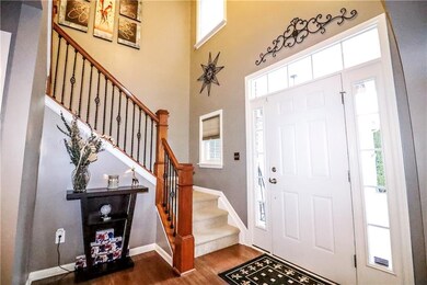 Inviting two-story foyer, the ideal way to enter this charming home. 