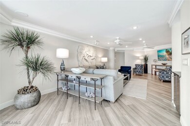 Living room with recessed lighting, ornamental molding, and light wood-style flooring