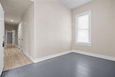 Spare room with hardwood / wood-style floors and 
