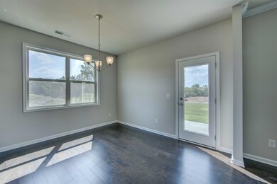 Bright breakfast area opens to back patio.  The start to your relaxing weekend!