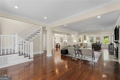 The bright sun lit living room is an open floor plan to your right