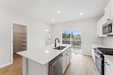 Functional flow and tons of surface space makes cooking and entertaining a breeze. Photo of same floorplan. Color and finish may vary.