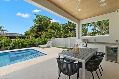 View of swimming pool featuring ceiling fan, sink,