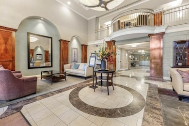 Lobby featuring a towering ceiling and recessed lighting