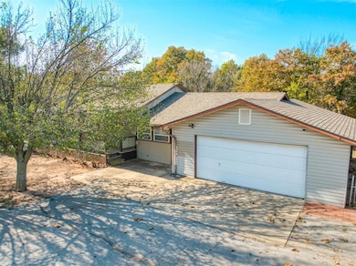 Garage featuring concrete driveway