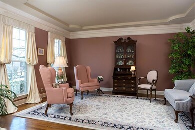 This formal dining room makes a great siting area or piano room with beautiful hardwoods and tons of natural light.