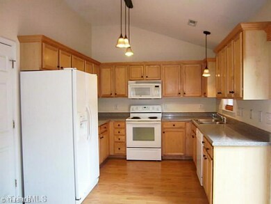Kitchen. Lots of cabinets. pantry, refrigerator remain, open to dining and living rooms