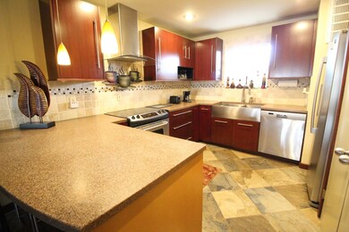  Spacious kitchen with large stainless steel sink,