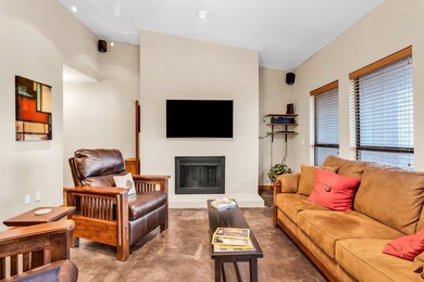 Living room featuring concrete flooring and a fir