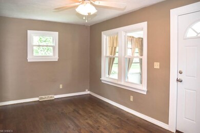 The formal living room has gorgeous, refinished ha