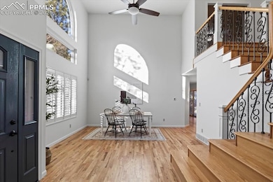 Enter into spacious room with a -story ceiling.
