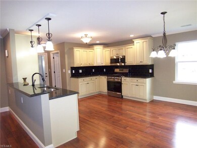 Here's the Kitchen!!  Upper end cabinets with soft
