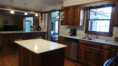 Kitchen is open to the family and game rooms.  Cen