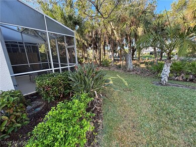 View of yard featuring glass enclosure