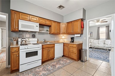 The kitchen is fully stocked with all cooking essentials, including dinner ware, pots and pans, a coffee maker, and more!