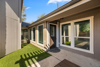 A covered porch provides a cozy, sheltered space ideal for seasonal décor or a quiet moment outdoors. The newly installed artificial turf is perfect for the low maintenance lifestyle!
