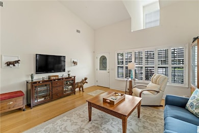 Living Room features high ceilings, Bamboo Hardwoo