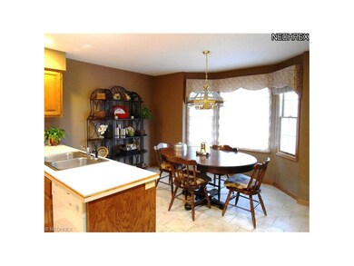 The bay window eating area in the Kitchen is brigh