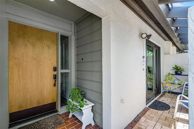 Entry with new door and courtyard.