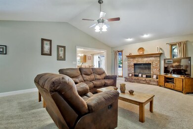 Large great room with brick fireplace.