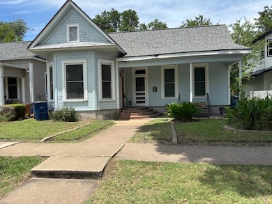 View of front of home featuring covered porch and