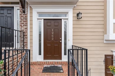 Property entrance with brick siding