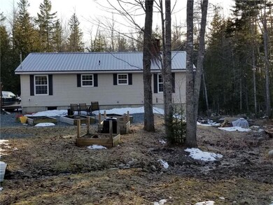 Rear of the home. 5 raised garden...