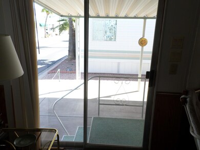 LIVING ROOM SLIDERS OUT TO CARPORT