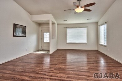 Beautiful, rich-toned hardwood flooring greets you