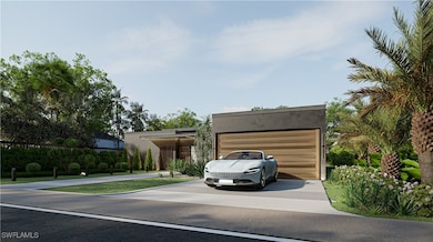 View of front of house featuring driveway and stuc