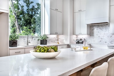 Waterfall countertop on your oversized island - Come tour our furnished model home open Saturday & Sunday 1-4PM 
Estimated completion November 30, 2025. Features 3 beds, 3.5 baths, 2 car garage, private driveway, office space, backyard and stainless steel Bosch appliances.