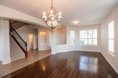 Unfurnished dining area featuring stairway, arche