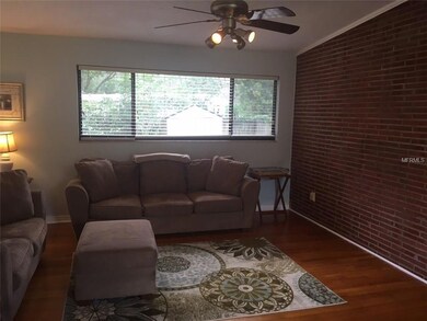 Living room with brick wall