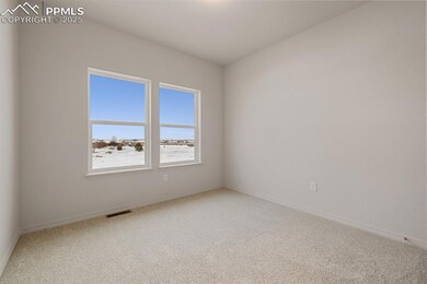 Spare room featuring light colored carpet