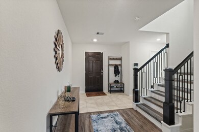 The foyer has access to the staircase to the secon