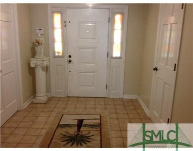 Foyer. Large tiled entry way with coat closet and 